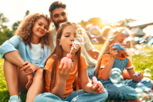 Happy family relaxing in the park